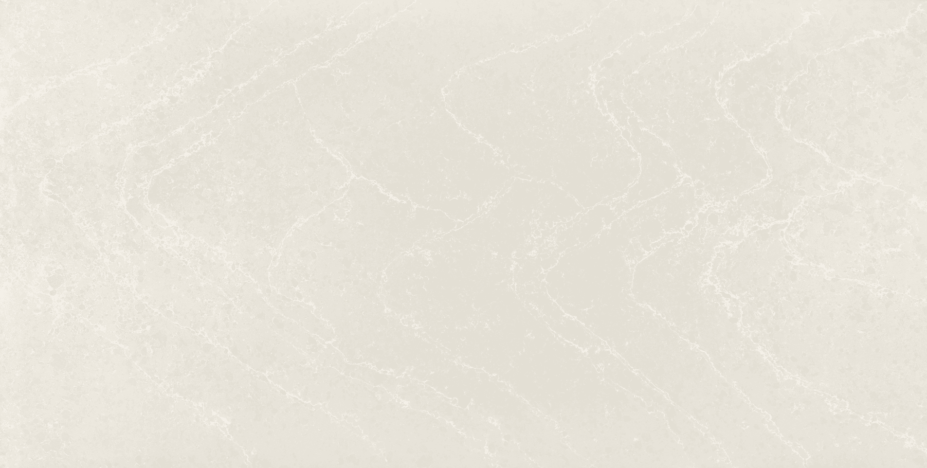 A cream quartz slab with soft grey veins